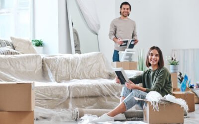 couple packing their luggage to swap home